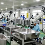stainless steel basin factory workers assembling sinks in a modern manufacturing facility.
